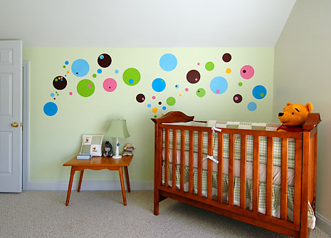 crib with wall and dots