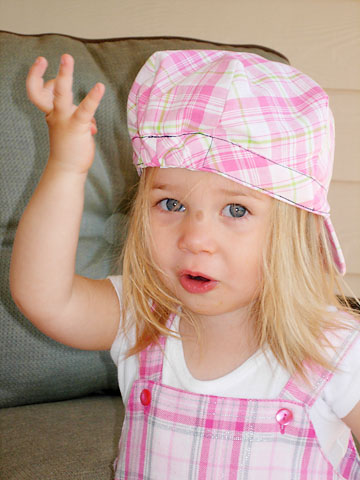 pink-hat-backwards-hand-up.jpg