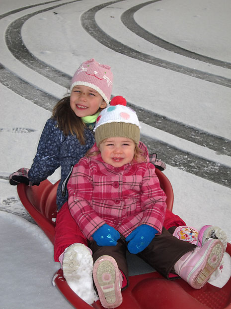 snow-girls-on-sled.jpg